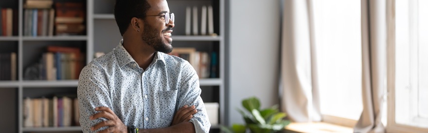 Starting Your Business - man smiling and looking out window